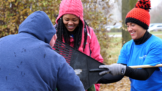 Women bagging leaves