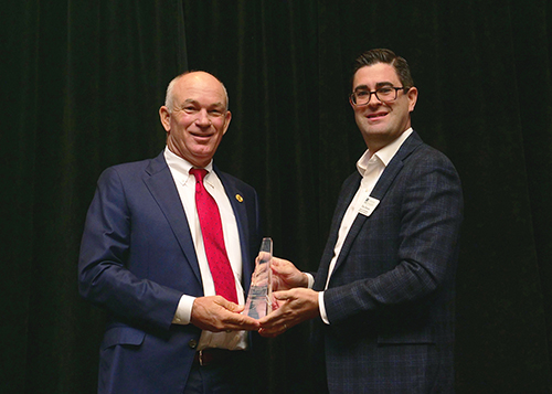 Rep. Ellington being presented with award by Dax Denton