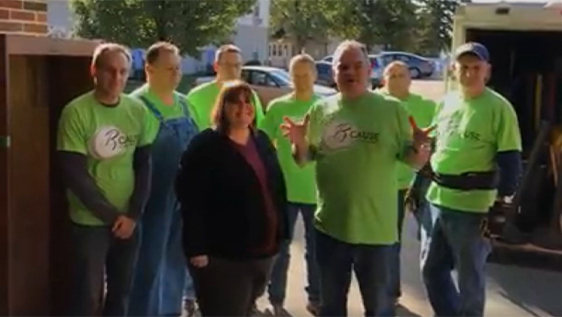 Bankers performing community service in matching shirts