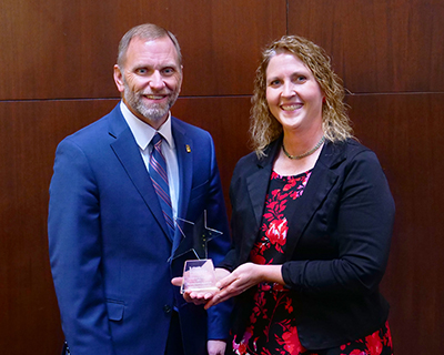 Rod Lasley and Susan Clark with award