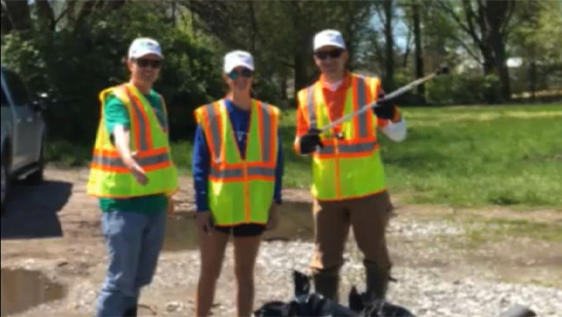 Bankers volunteering outdoors