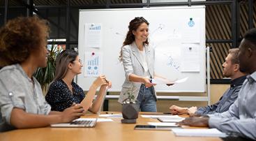 Woman speaking with colleagues